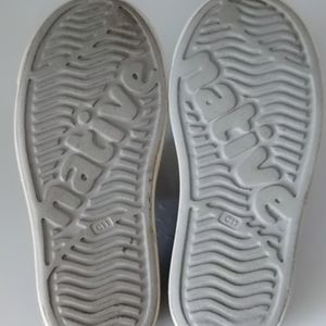 Shoes looks almost same of Crocs. The brand name is Native. Rubberized. Size-11